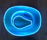 Cowgirl Dark Top View Shows the blue lights shining brightly illuminating the blue iridescent hat against the dark background