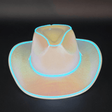 Cowgirl Dark View Shows the blue lights shining brightly illuminating the white iridescent hat against the dark background